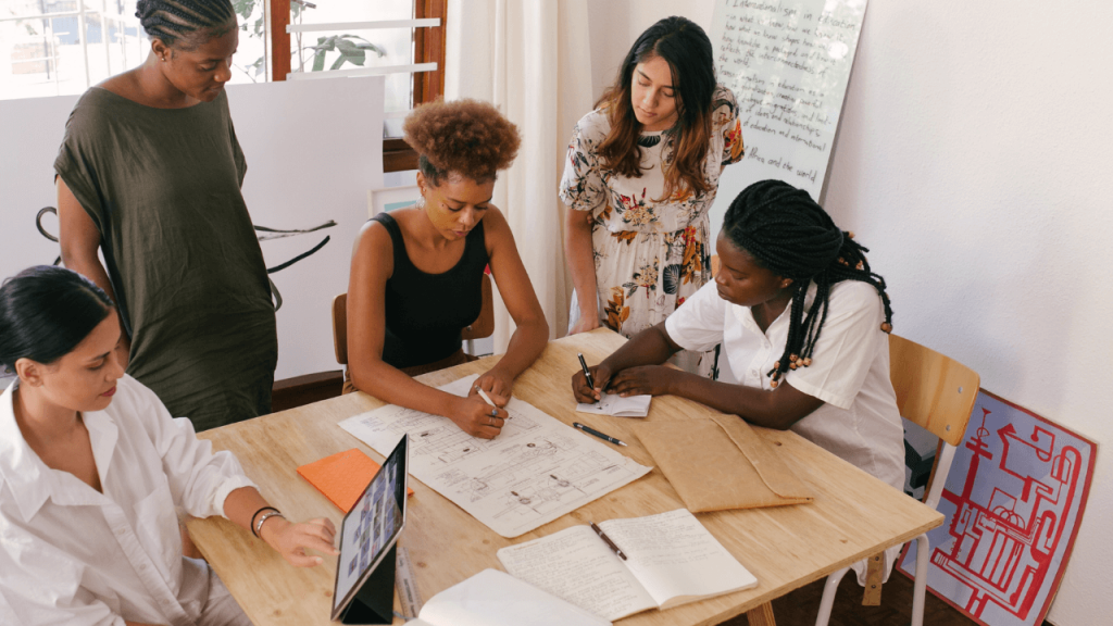 image of a team communication setting where a group is discussing ideas